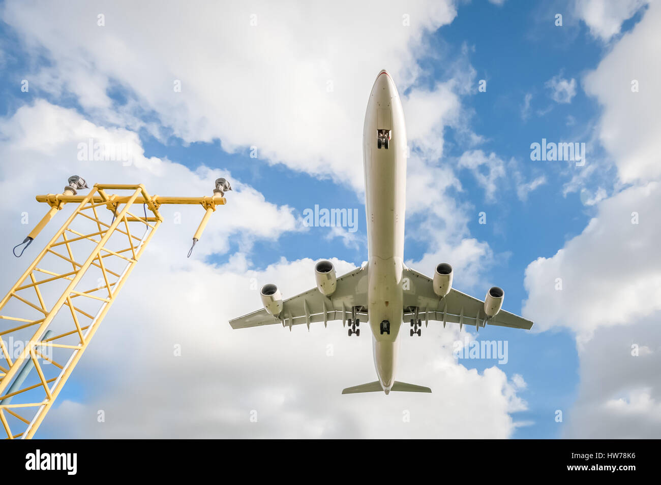 wide-angle view of a passenger jet landing at an airport Stock Photo