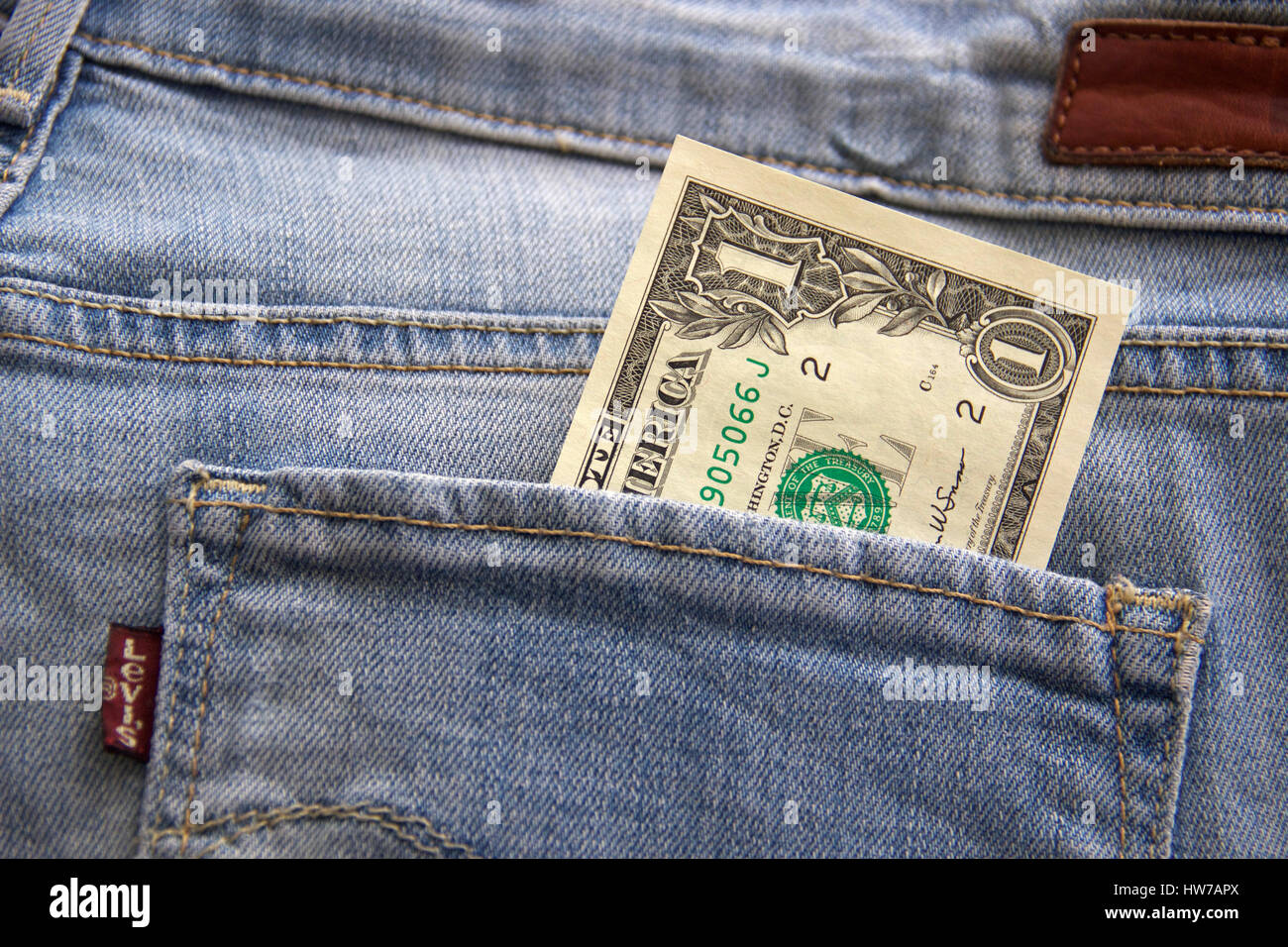 One Dollar in Jeans pocket Stock Photo