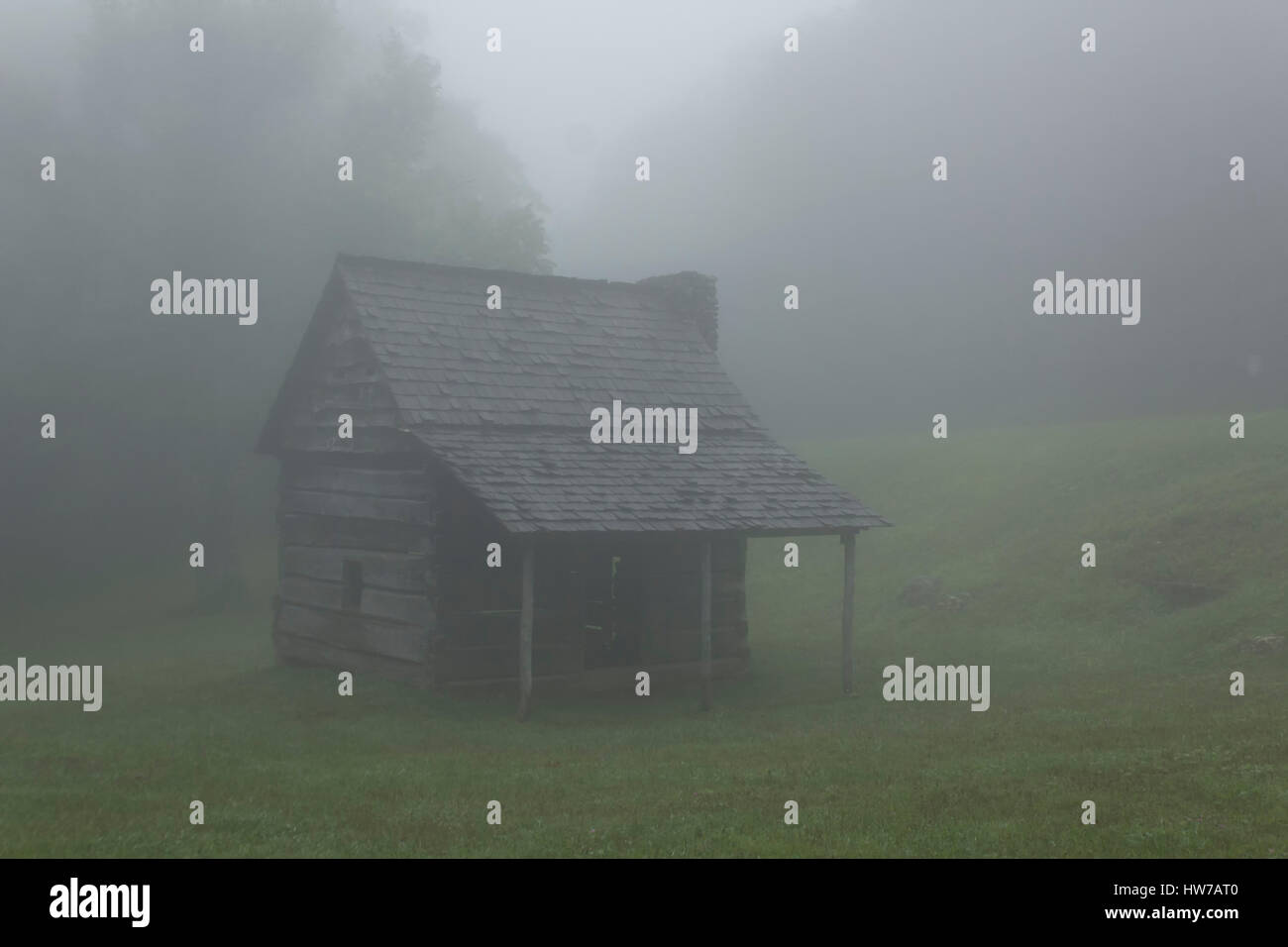 Log Cabin In Fog In The Blue Ridge Mountains Stock Photo
