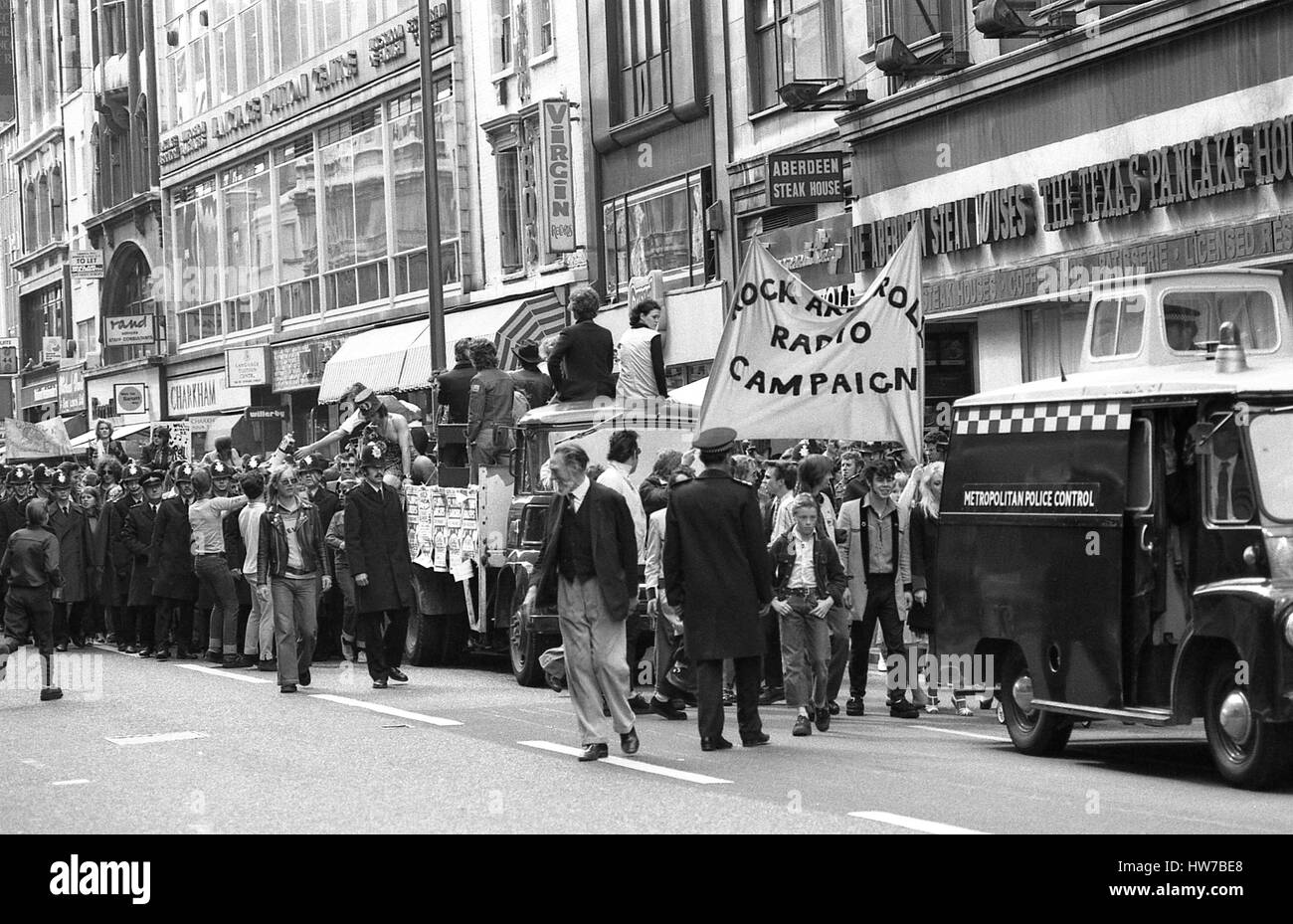 Music fans take part in the Rock and Roll Radio Campaign march through Central London, England on May 15, 1976. The campaign aimed to get more fifties style rock and roll music played on BBC radio. Stock Photo
