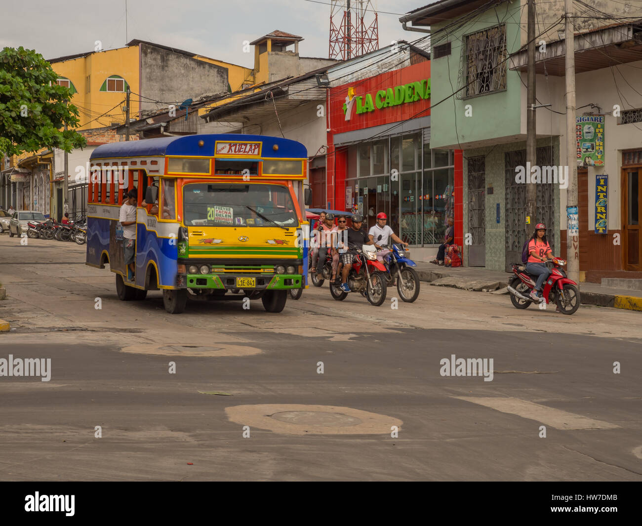 Iquitos, Peru- May 14, 2016: Corolful bus on street of a small southern town. Stock Photo