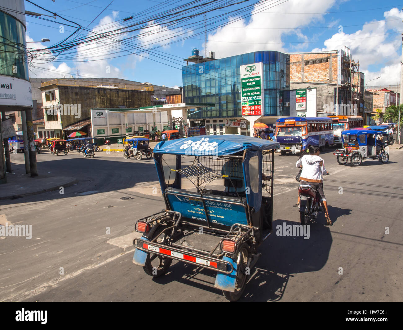 Iquitos, Peru- May 14, 2016: Various rickshaws on a  street of a small town. Stock Photo