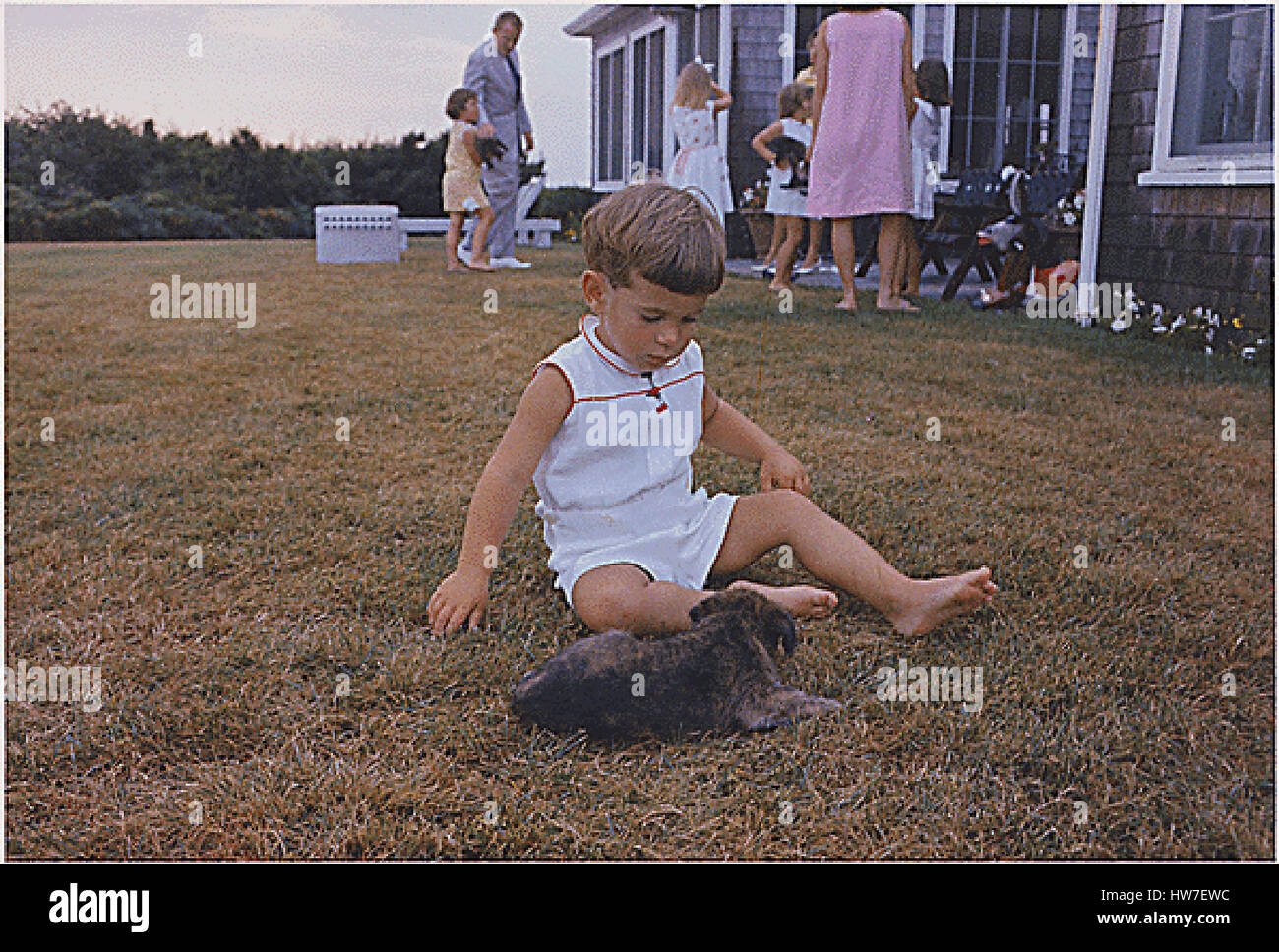 Hyannisport MA Squaw Island -- John F. Kennedy Jr. with puppy on in Hyannisport Massachusetts on August 3 1963. Mandatory Credit: Cecil Stoughton - The White House via CNP /MediaPunch Stock Photo