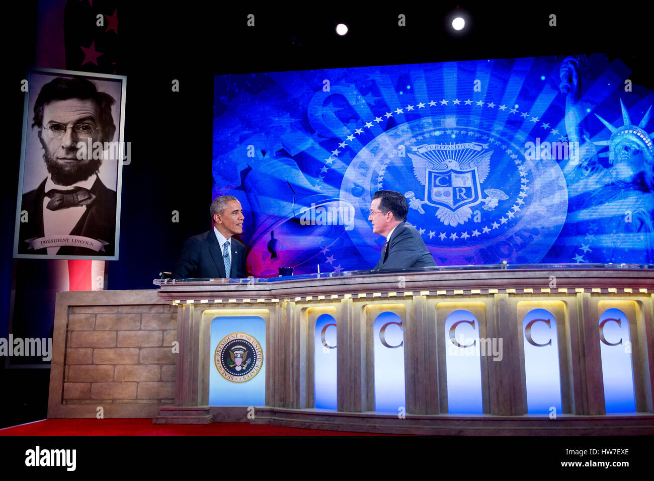 United States President Barack Obama left talks to television personality Stephen Colbert during taping of Comedy Central's 'The Colbert Report' in Lisner Auditorium on the campus of George Washington University in Washington D.C. U.S. on Monday December Stock Photo