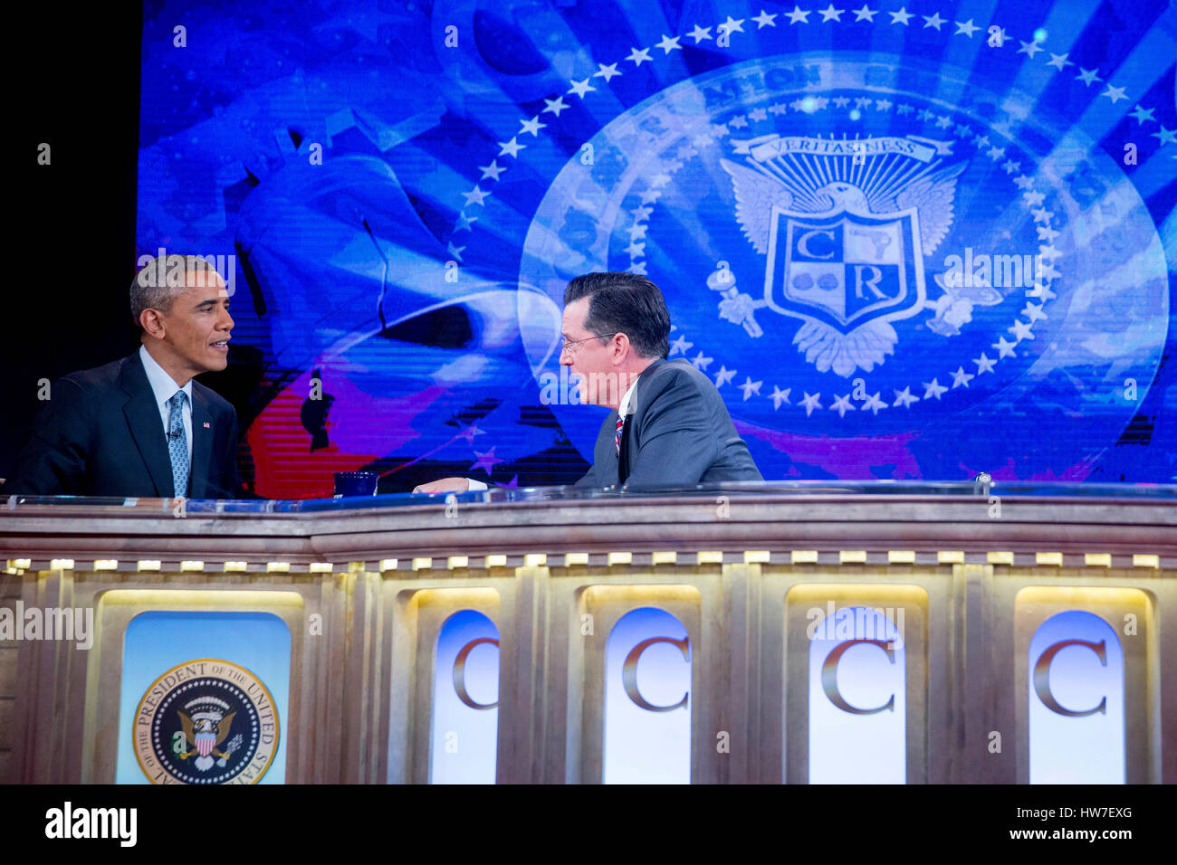 United States President Barack Obama left talks to television personality Stephen Colbert during taping of Comedy Central's 'The Colbert Report' in Lisner Auditorium on the campus of George Washington University in Washington D.C. U.S. on Monday December Stock Photo