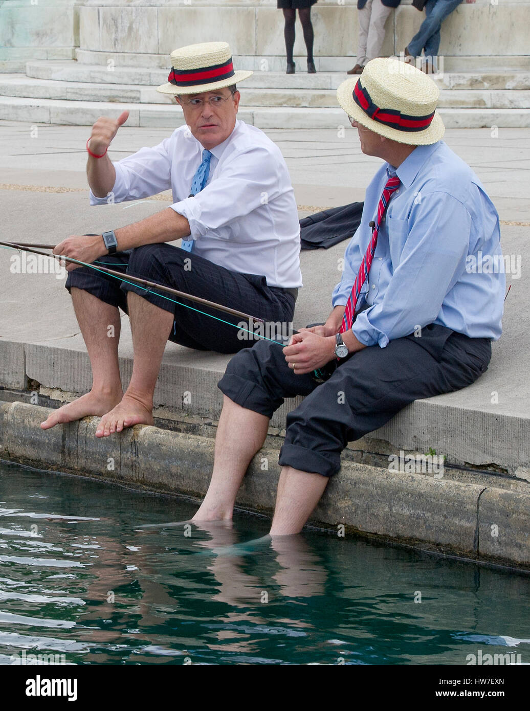 Stephen Colbert host of the Comedy Central show 'The Colbert Report' works on bit with United States Representative Jack Kingston (Democrat of Georgia) where they appear to be fishing in U.S. Capitol Reflecting Pool in Washington D.C. on Friday October 3 Stock Photo