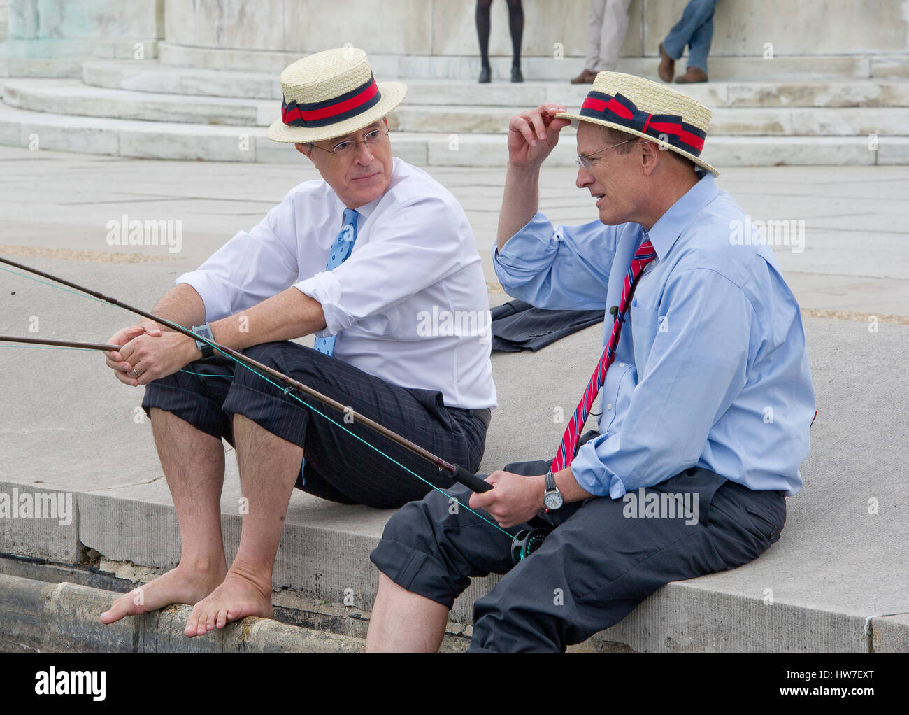 Stephen Colbert host of the Comedy Central show 'The Colbert Report' works on bit with United States Representative Jack Kingston (Democrat of Georgia) where they appear to be fishing in U.S. Capitol Reflecting Pool in Washington D.C. on Friday October 3 Stock Photo
