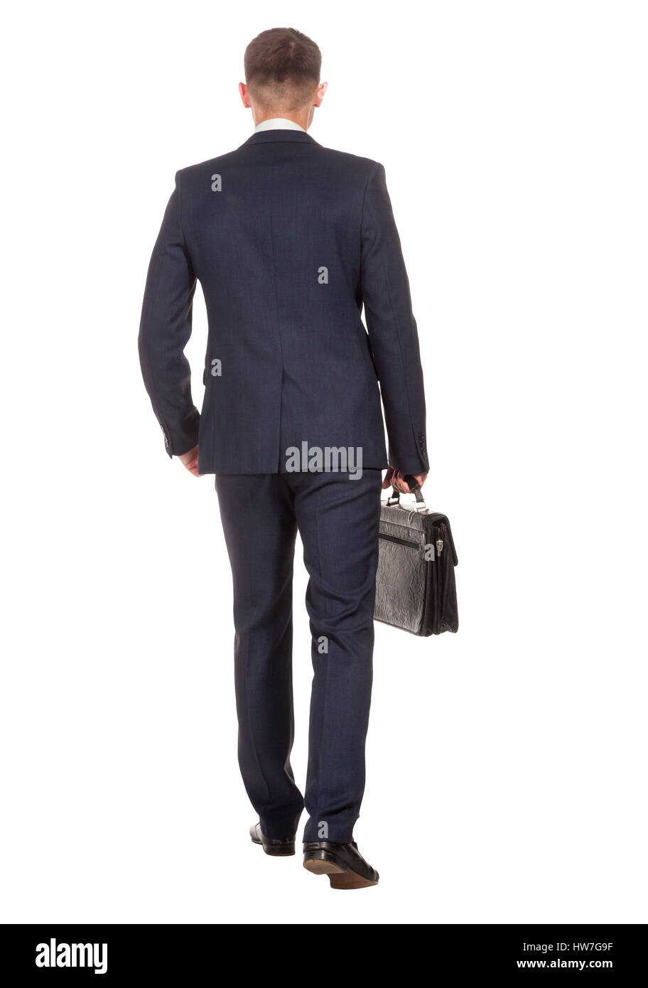 Businessman with briefcase walking away on white Stock Photo