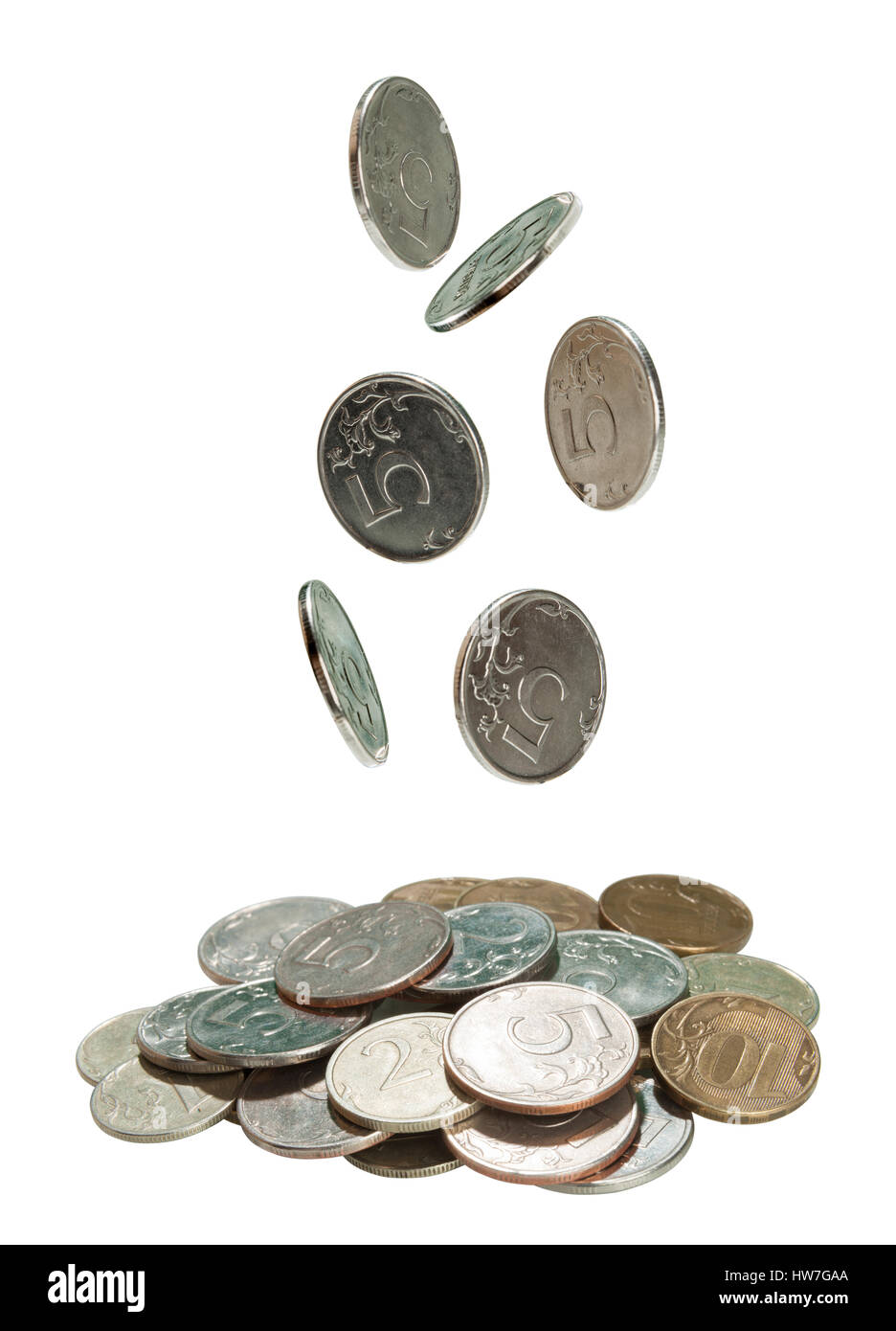 Coins falling into a pile on white Stock Photo