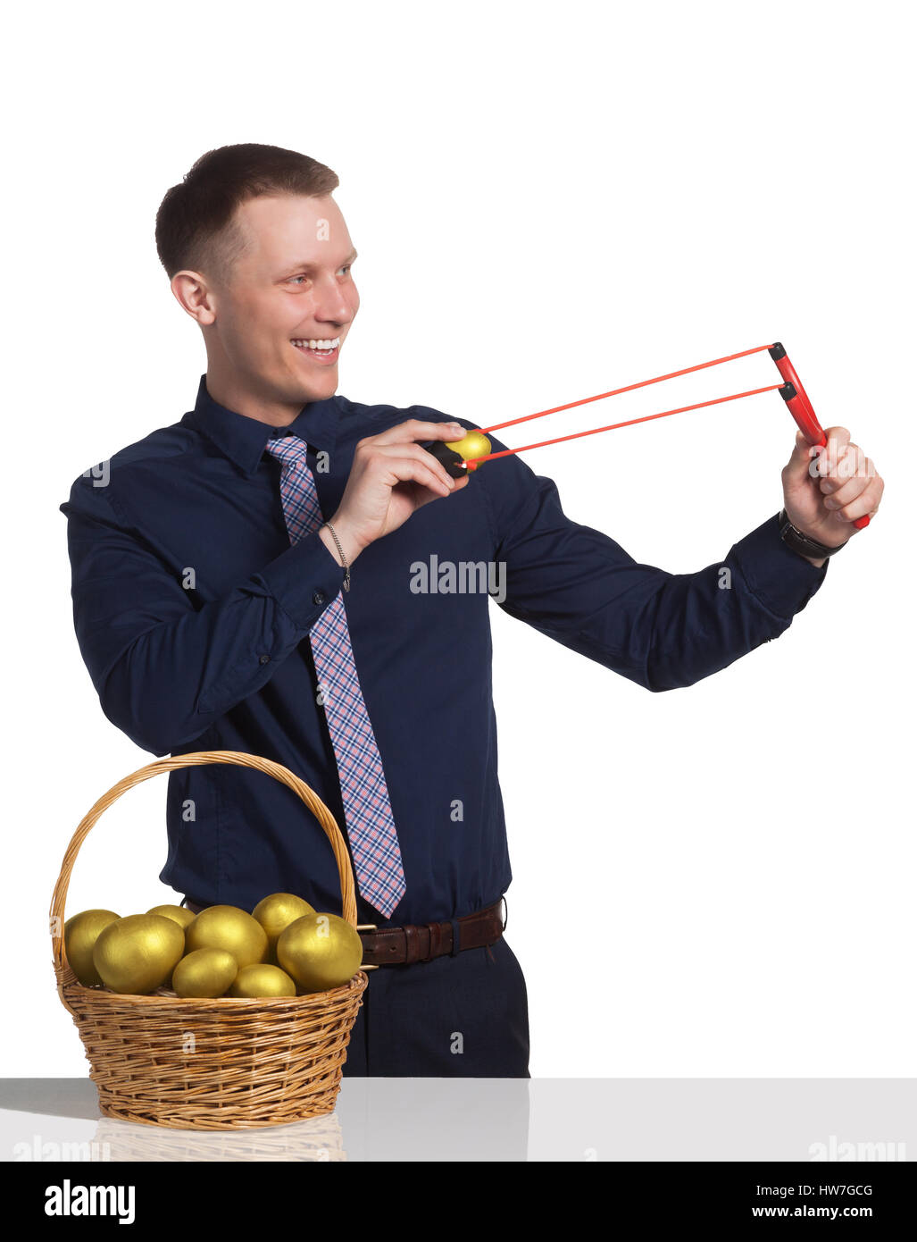 Young businessman make investments with help slingshot Stock Photo