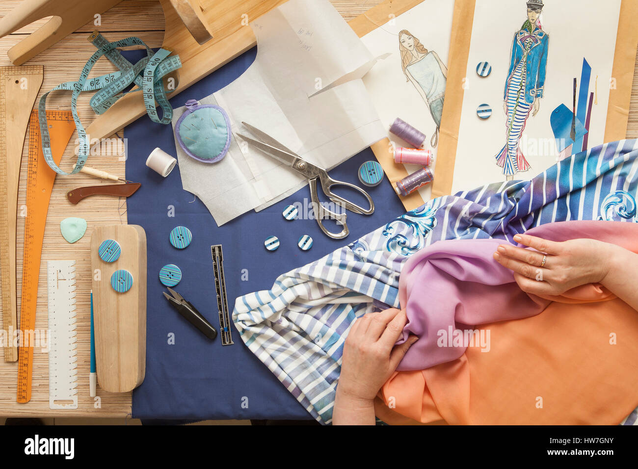 Table of skilled tailors working Stock Photo Alamy
