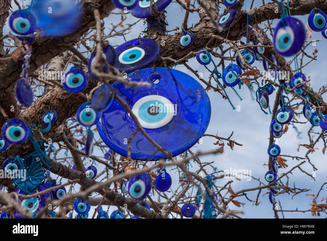 A tree decorated with Evil Eyes above Goreme, Turkey. Stock Photo