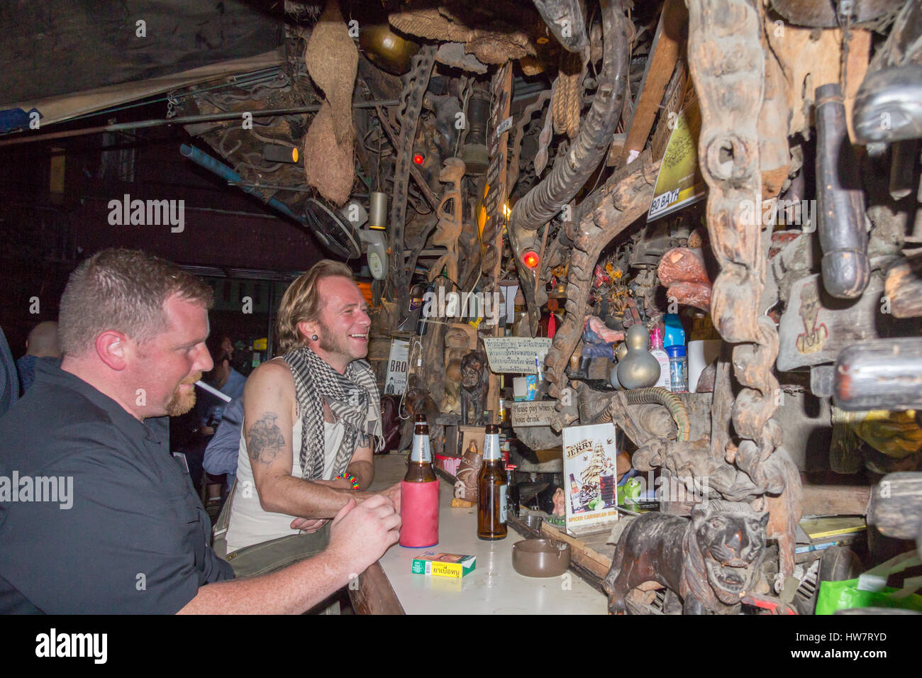 Customers in Cheap Charlie's bar in Bangkok, Thailand. The bar is world