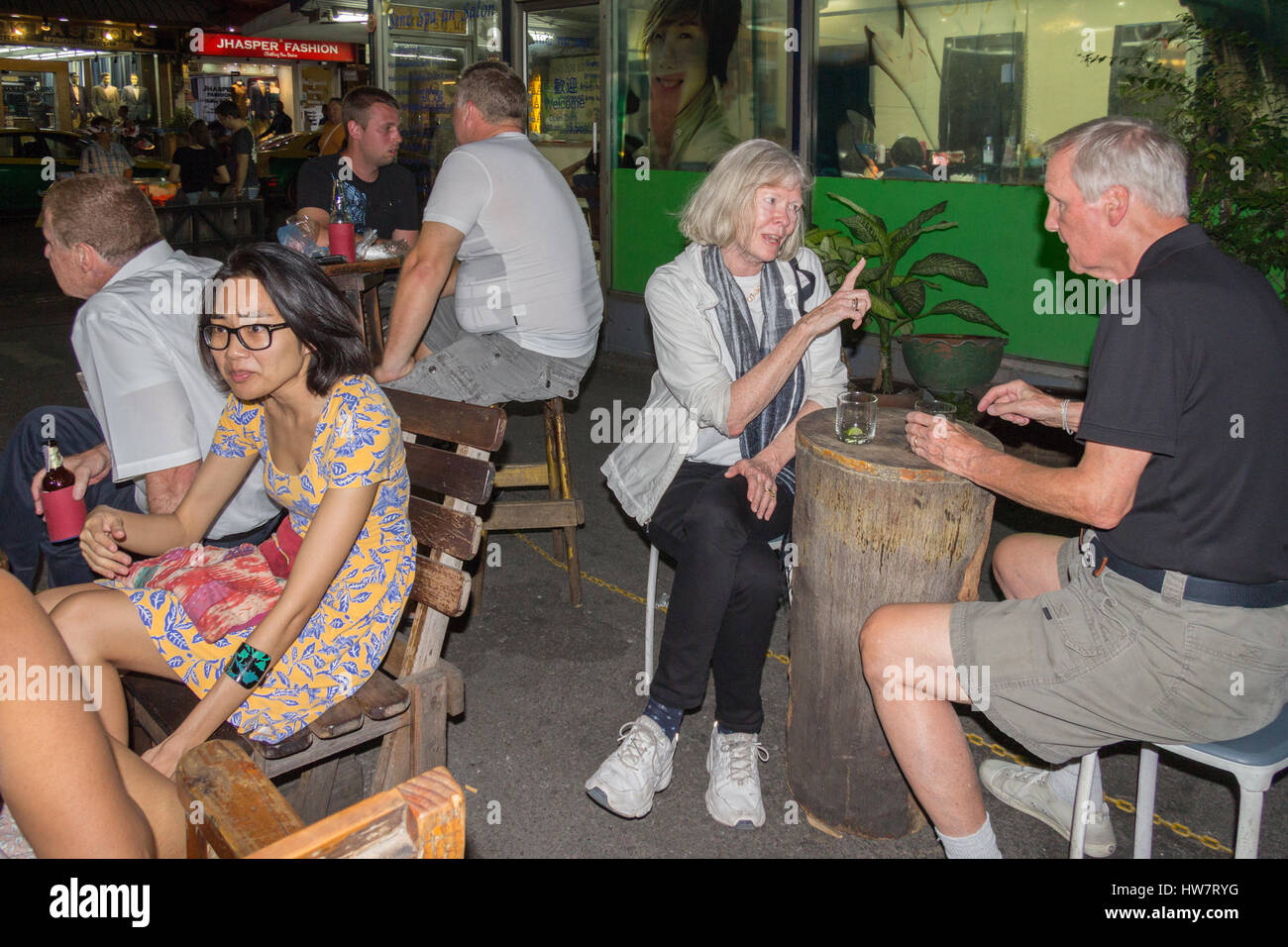 Customers in Cheap Charlie's bar in Bangkok, Thailand. The bar is world