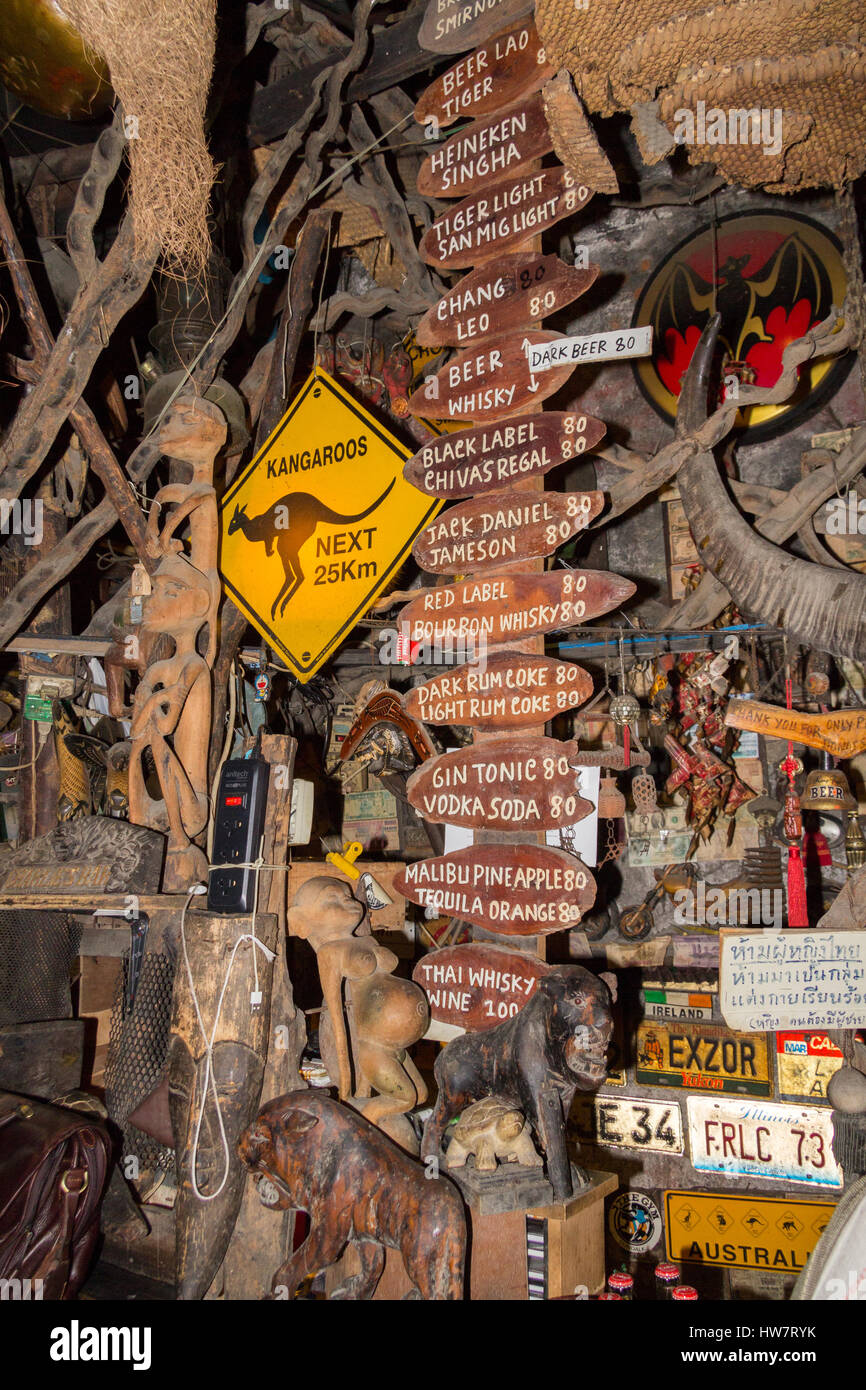 Signs in Cheap Charlie's bar in Bangkok, Thailand. The bar is world