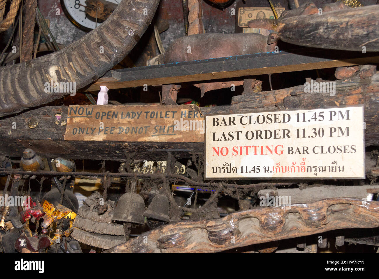 Signs in Cheap Charlie's bar in Bangkok, Thailand. The bar is world