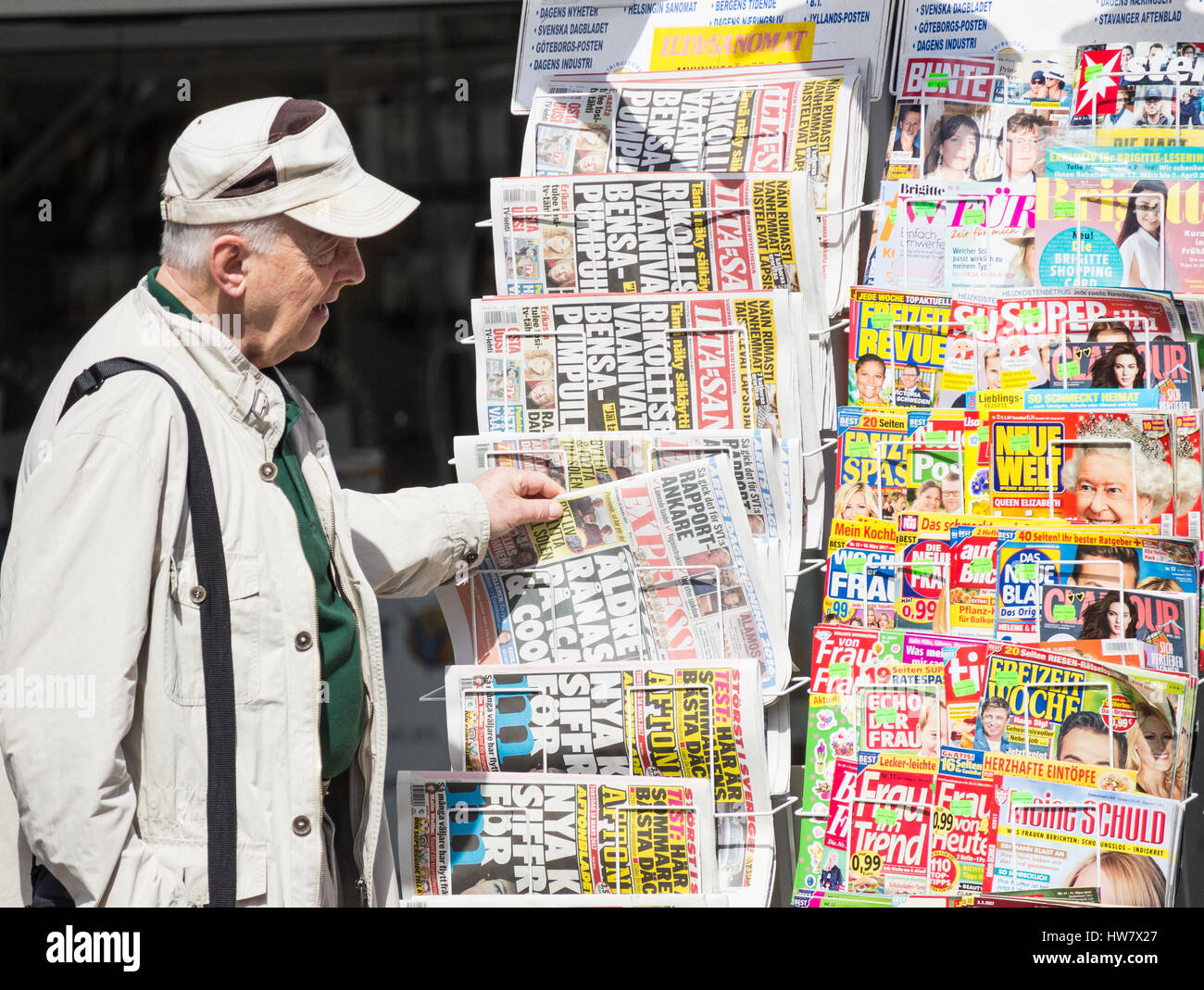 Elderly man buying newspaper at news kiosk in Spain Stock Photo Alamy