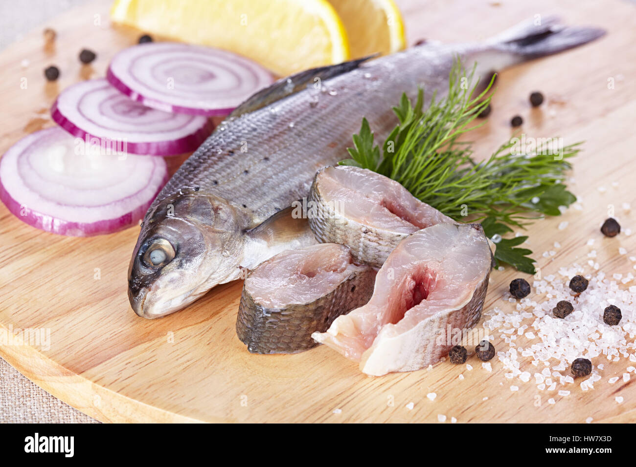 Lightly salted grayling on a chopping board Stock Photo