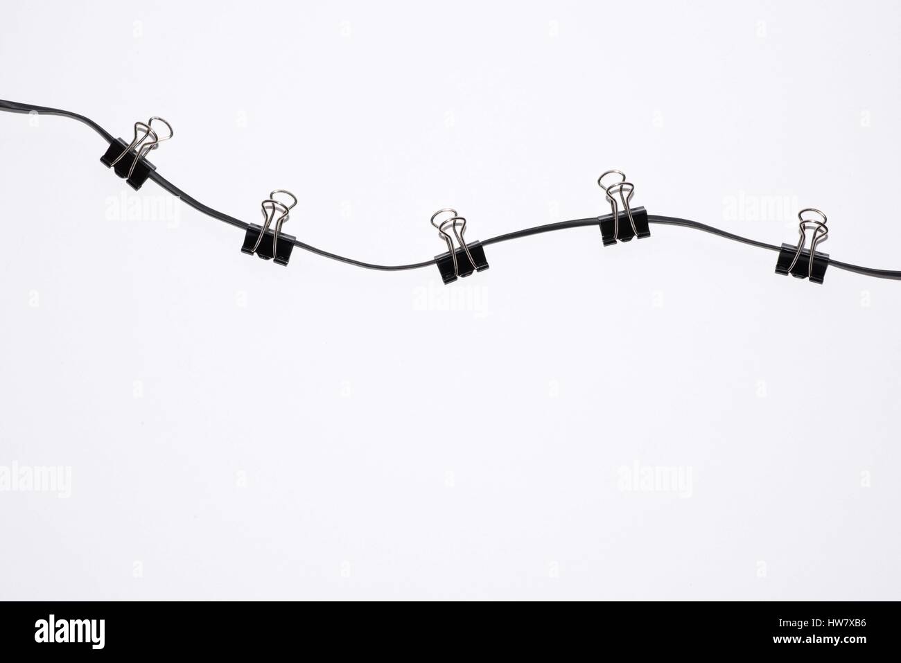 office paper clips on rope isolated on white Stock Photo Alamy