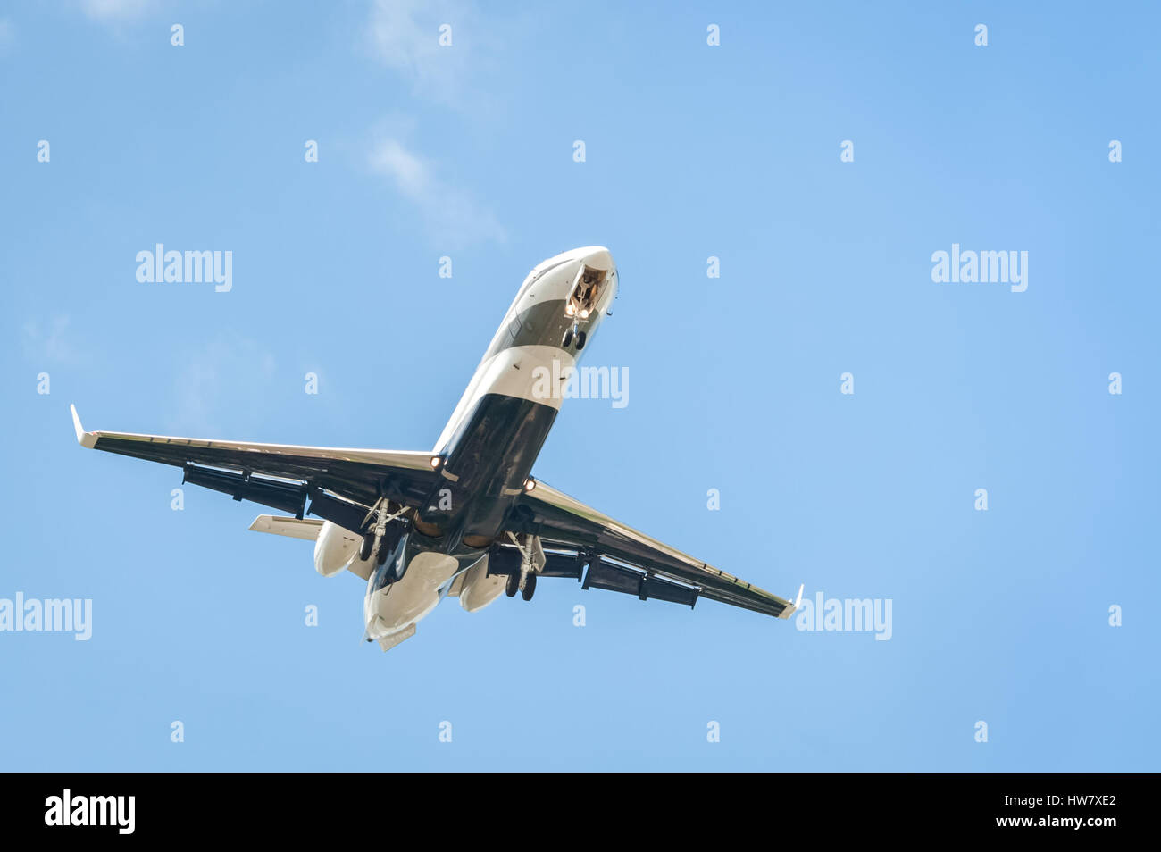 small corporate business jet on landing approach with copy-space Stock Photo