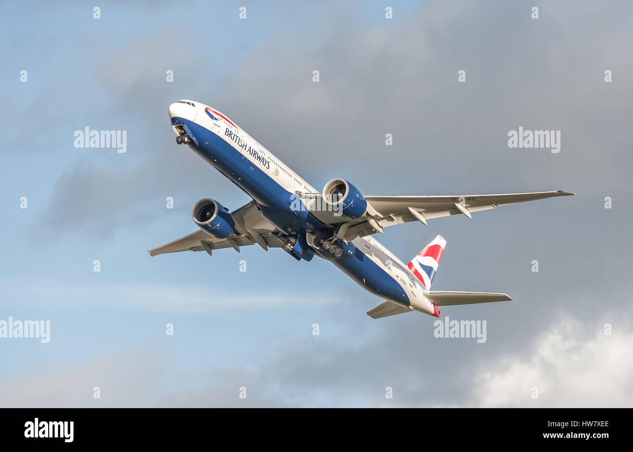 British Airways Boeing 777 retracting its undercarriage on take-off from Heathrow Airport, London, UK Stock Photo