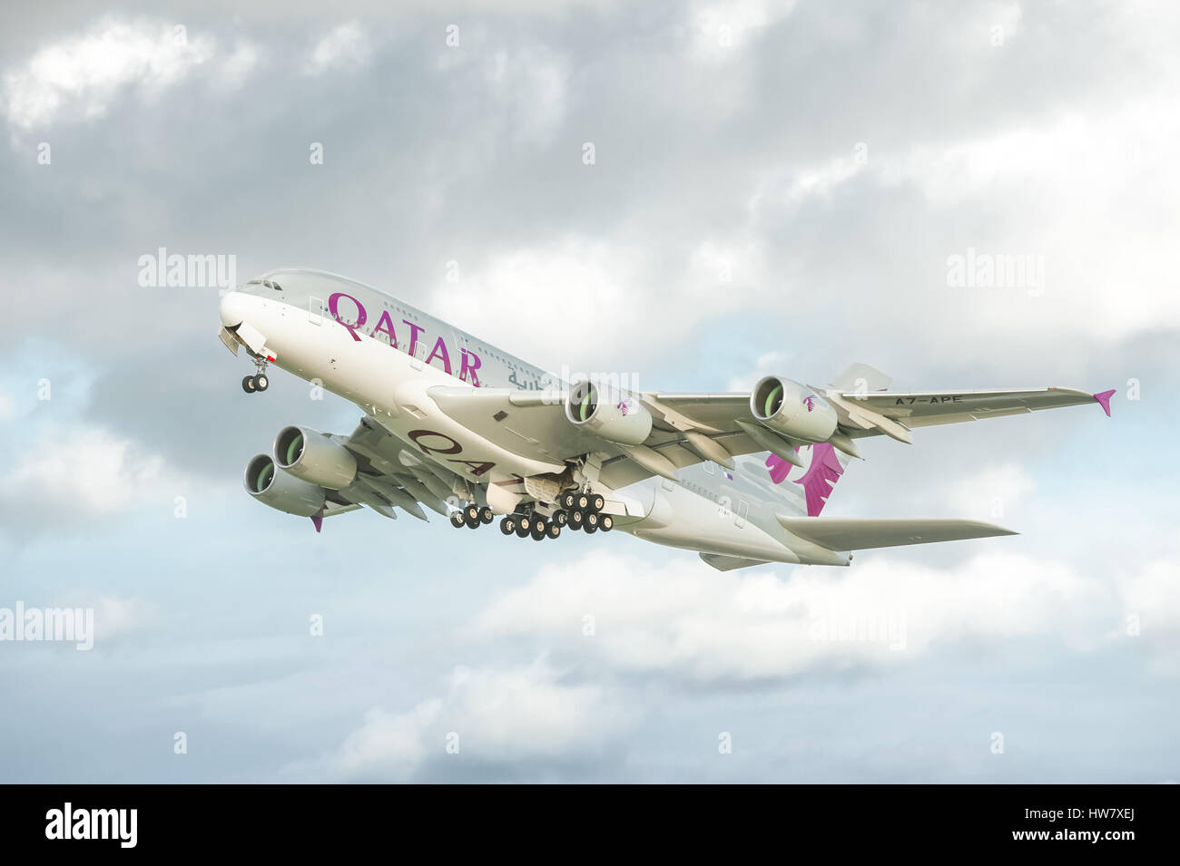 Qatar Airways Airbus A380 take-off catching the last rays of sunshine before rain rolls in over Heathrow Airport, London, UK Stock Photo