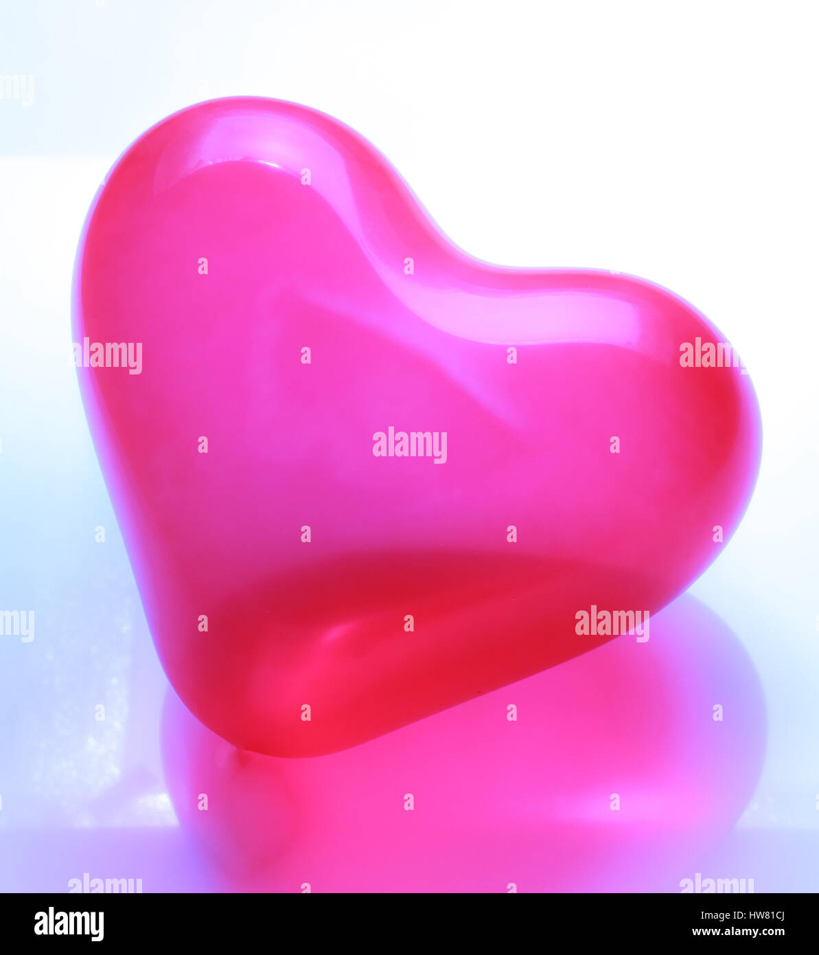 Red heart shaped balloon on white background Stock Photo - Alamy