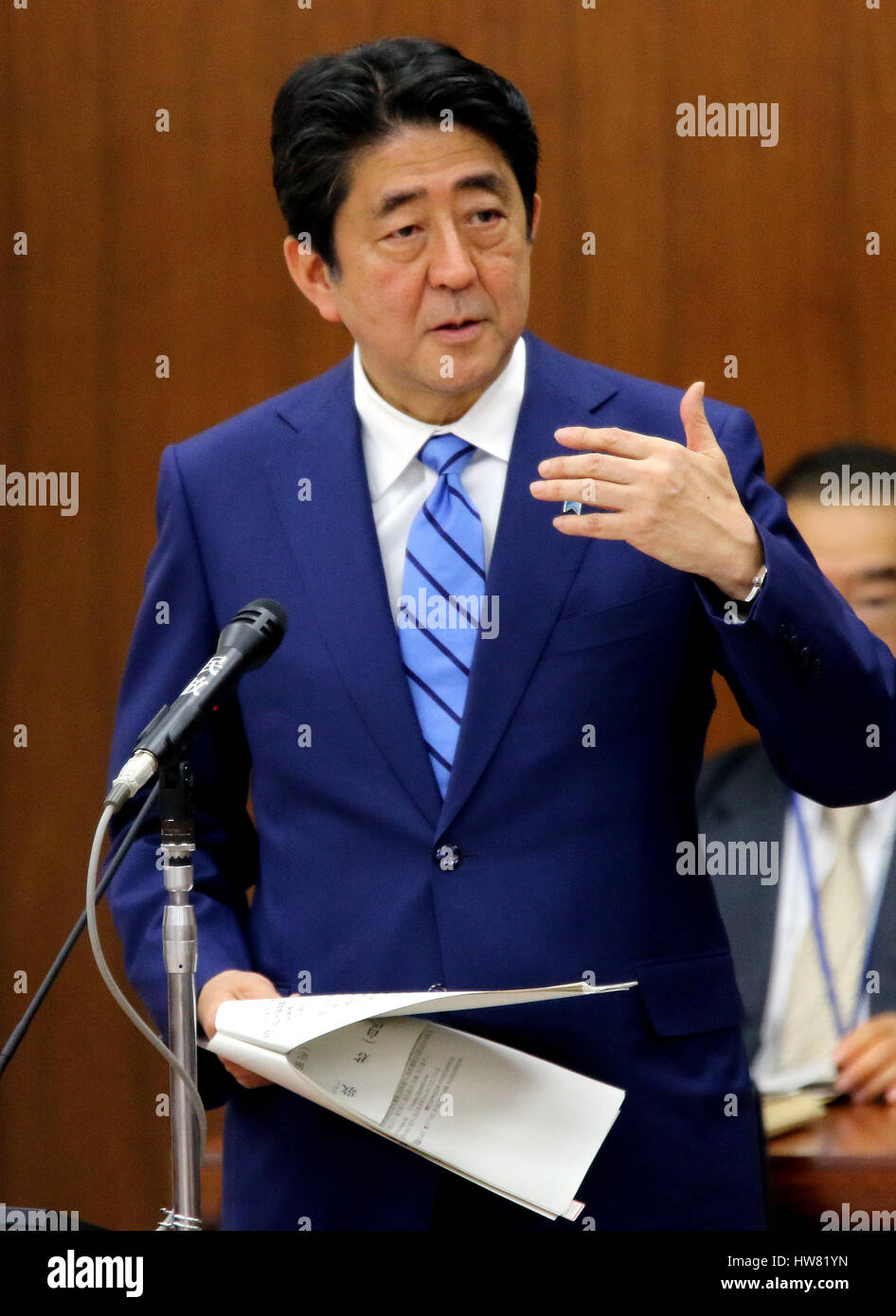 Tokyo, Japan. 17th Mar, 2017. Japanese Prime Minister Shinzo Abe answers a question by an opposition lawmaker at the Lower House's foreign affairs committee session at the National Diet in Tokyo on Friday, March 17, 2017. Abe is now center in a land deal scandal of a Osaka elementary school as he donated to the school operator Yasunori Kagoike, news reported. Credit: Yoshio Tsunoda/AFLO/Alamy Live News Stock Photo
