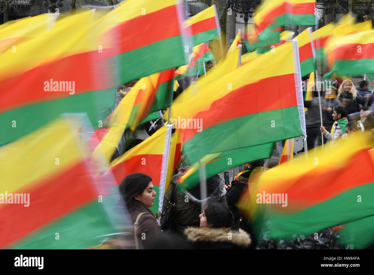 Frankfurt, Germany. 18th Mar, 2017. Kurdish protestors hold up flags of ...