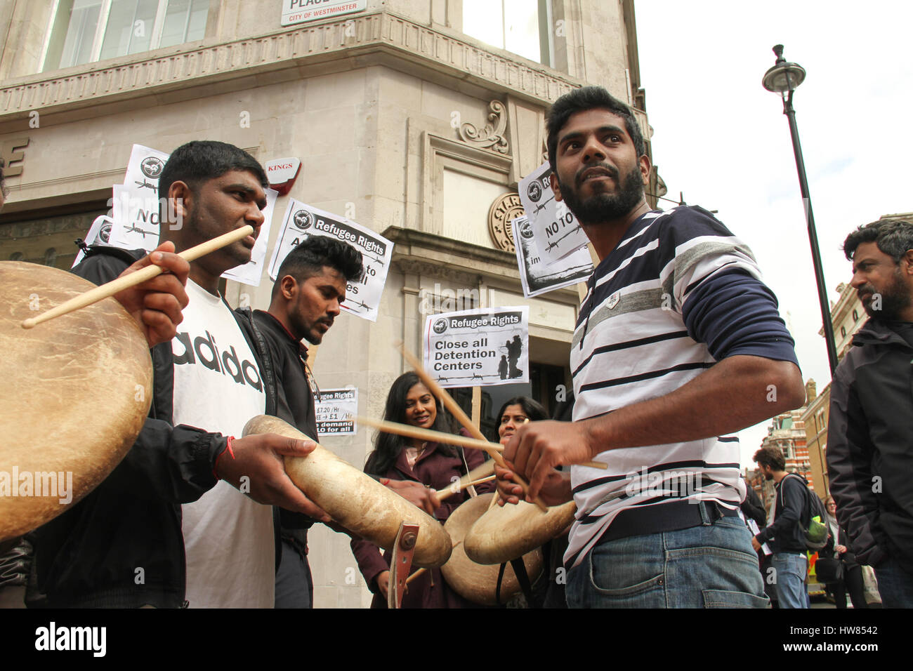 London, UK. March 18, 2017: Indian immigrants drum and chant as they prepare to participate in the Stand Up To Racism demonstration on UN Anti-Racism Day in the streets of London on March 18, 2017. The march began at Portland Place (BBC) and ended at Parliament Square, where a rally is scheduled. The UN Anti-Racism Day is a global day of action against racism in all its forms. © David Mbiyu/Alamy Live News Stock Photo