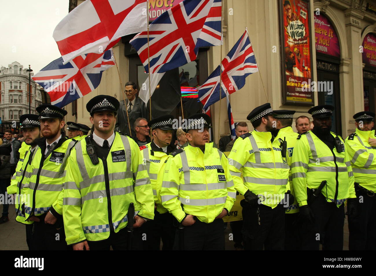 London, UK, 18th March 2017. Police surround a small group of far-right protests as campaign group Stand Up to Racism holds a march through central London to mark UN anti-racism day. Roland Ravenhill/ Alamy Live News Stock Photo