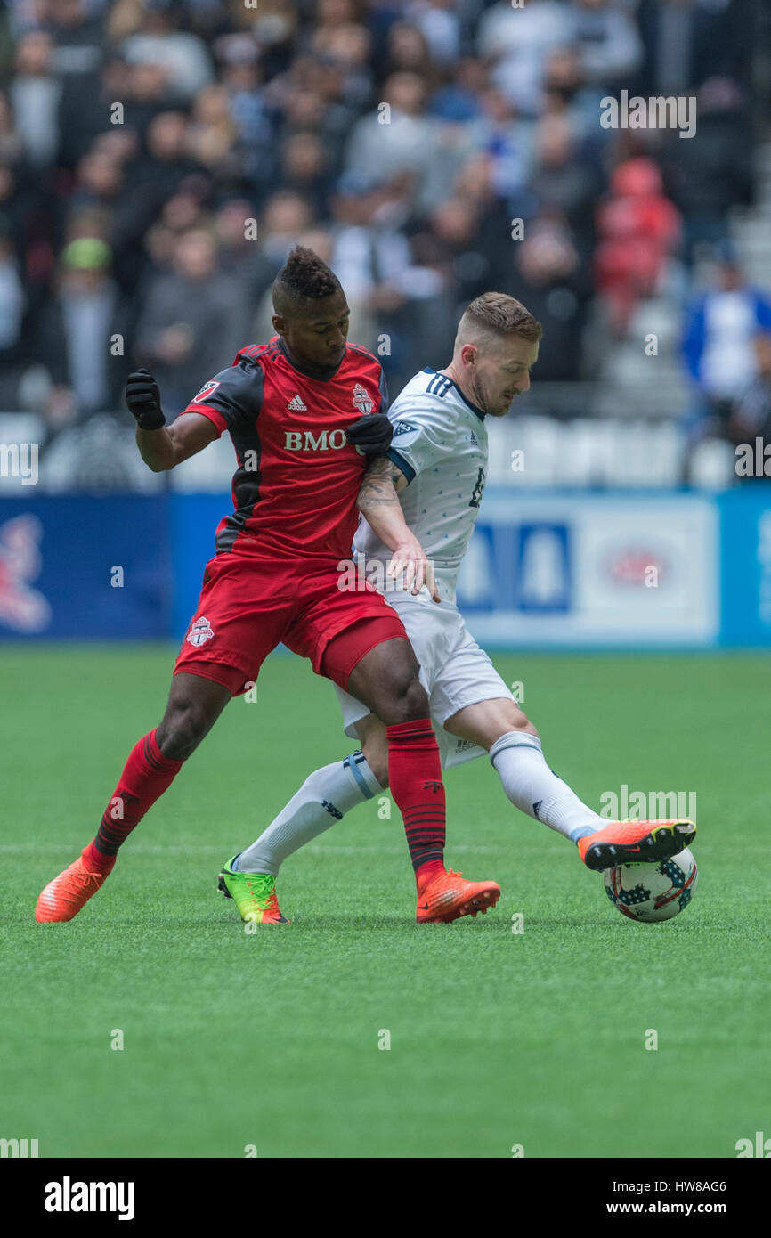 Vancouver, Canada. 18 March, 2017. Armando Cooper #31 of Toronto FC and Jordan Harvey #2 of Vancouver Whitecaps fighting for the ball. Vancouver Whitecaps vs Toronto FC, BC Place Stadium.  © Gerry Rousseau/Alamy Live News Stock Photo