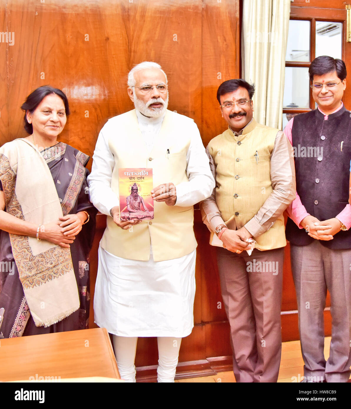 New Delhi, March, 18, 2017. Vedic wizard Dr Mridul Kirti presented her newly published book Patanjali Yog-Darshan, published by Prabhat Prakashan, to Honorable Prime Minister of India Shri Narendra Modi. Spun with an engaging narrative and written in a simple language, Patanjali Yog-Darshan is a unique compendium of mysteries and secrets of Yogic science that reveals the journey of life and death, secrets of mortal and immortal. The Prime Minister appreciated the work and gave his blessings to the author. He spoke on the richness of Indian Literature and said that we need to invest our efforts Stock Photo