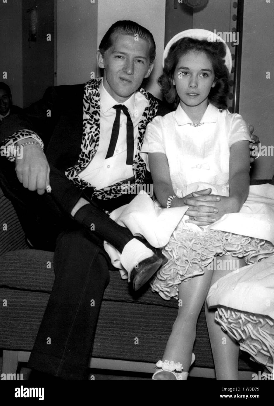 Mar. 26, 1958 - Home Office To Investigate Marriage of Jerry Lee Lewis; The Home Office is tomorrow to investigate the marriage middle of the 22 year old American Rock n Roll singer, Jerry Lee Lewis, who is over here on tour - and his 15 year old wife, Myra. Lewis and Myra are staying in London. During the week-end it was discovered that their marriage last December was fix became final. Myra's father Mr. J.W. Brown, his wife, Lois and his son, are staying at the same hotel in London. Home Office Officials will look into the marriage when Lewi's landing papers are forwarded from Immigration Of Stock Photo