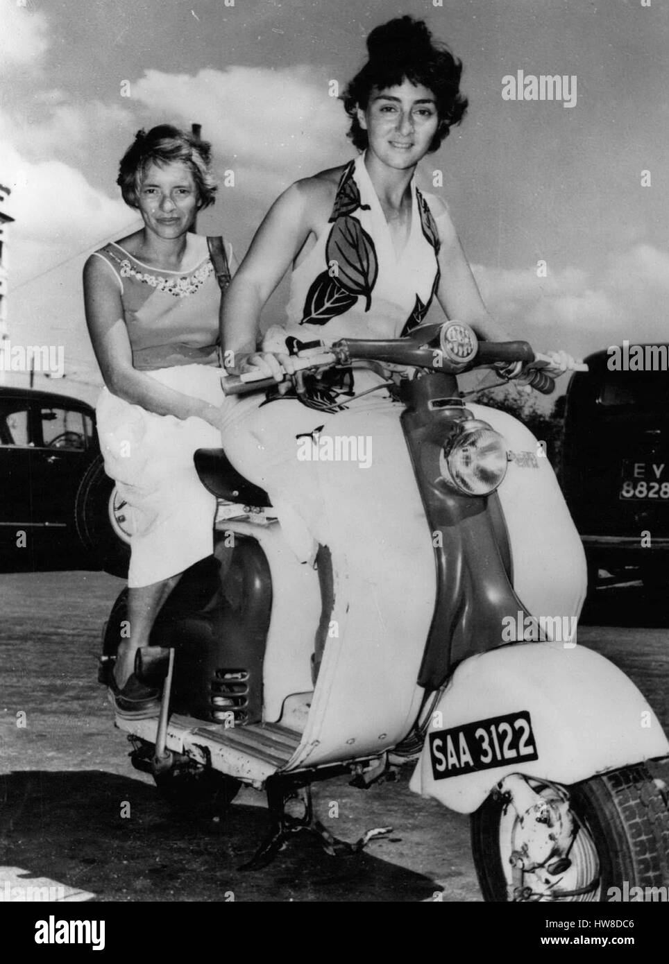 Jan. 26, 1959 - Young tourist in Ceylon, girls from Toronto and New York; Rosalyn Rappaport a night club singer from Toronto Canada and Suzanne Moos an industrial chemist from New York seen on their arrival in Colombo, Ceylon - with their scooter after an eight months extensive tour in the East - visiting Malaya Thailand, Burma, India and Singapore. Rosalyn left her family in London two years ago to settle down in Canada. Suzanne's family is in Germany. The two girls were close friends during their University days in New York. The girls said that they overcame the language difficulties wheneve Stock Photo