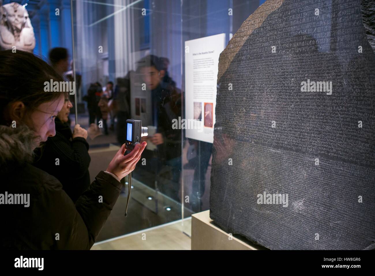 England, London, Bloomsbury, The British Museum, Egyptian Room, The Rosetta Stone, its discovery allowed the deciphering of the ancient Egyptian alphabet, being photographed by cell phone Stock Photo
