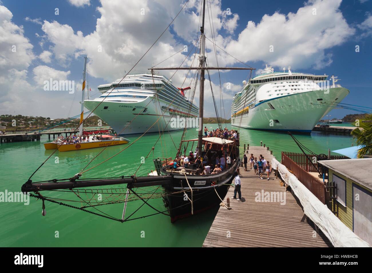 Antigua and Barbuda, Antigua, St. Johns, Heritage Quay, Cruiseship terminal with party boats Stock Photo