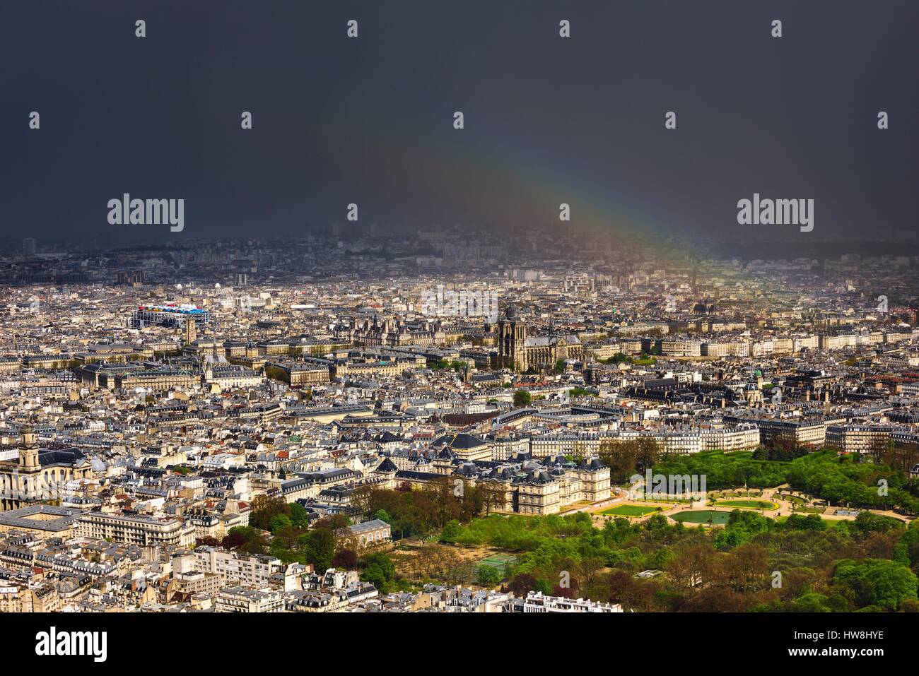 France, Paris, a rainbow of the the jardin du Luxembourg and the Pantheon, Hotel de Ville, Notre Dame de Paris and the Centre Beaubourg in the background (aerial view) Stock Photo