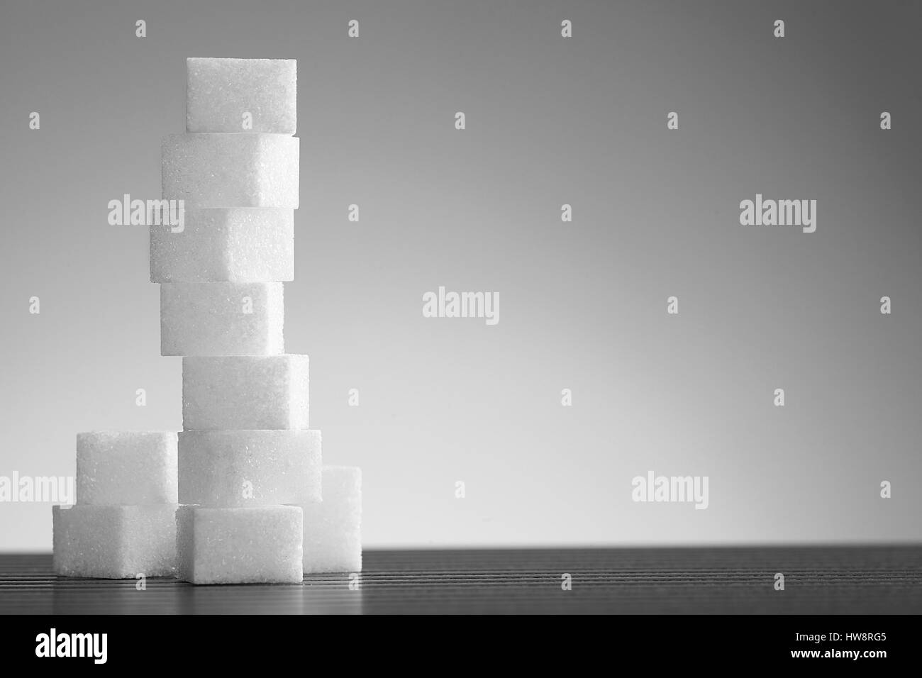 Pile of lump sugar on white background with empty space for text Stock Photo