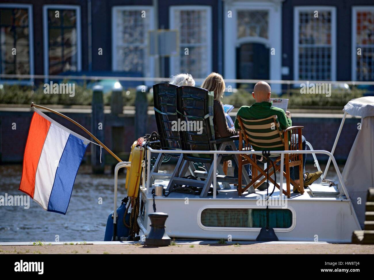 Netherlands, Holland, Haarlem, sunbathing on a boat Stock Photo