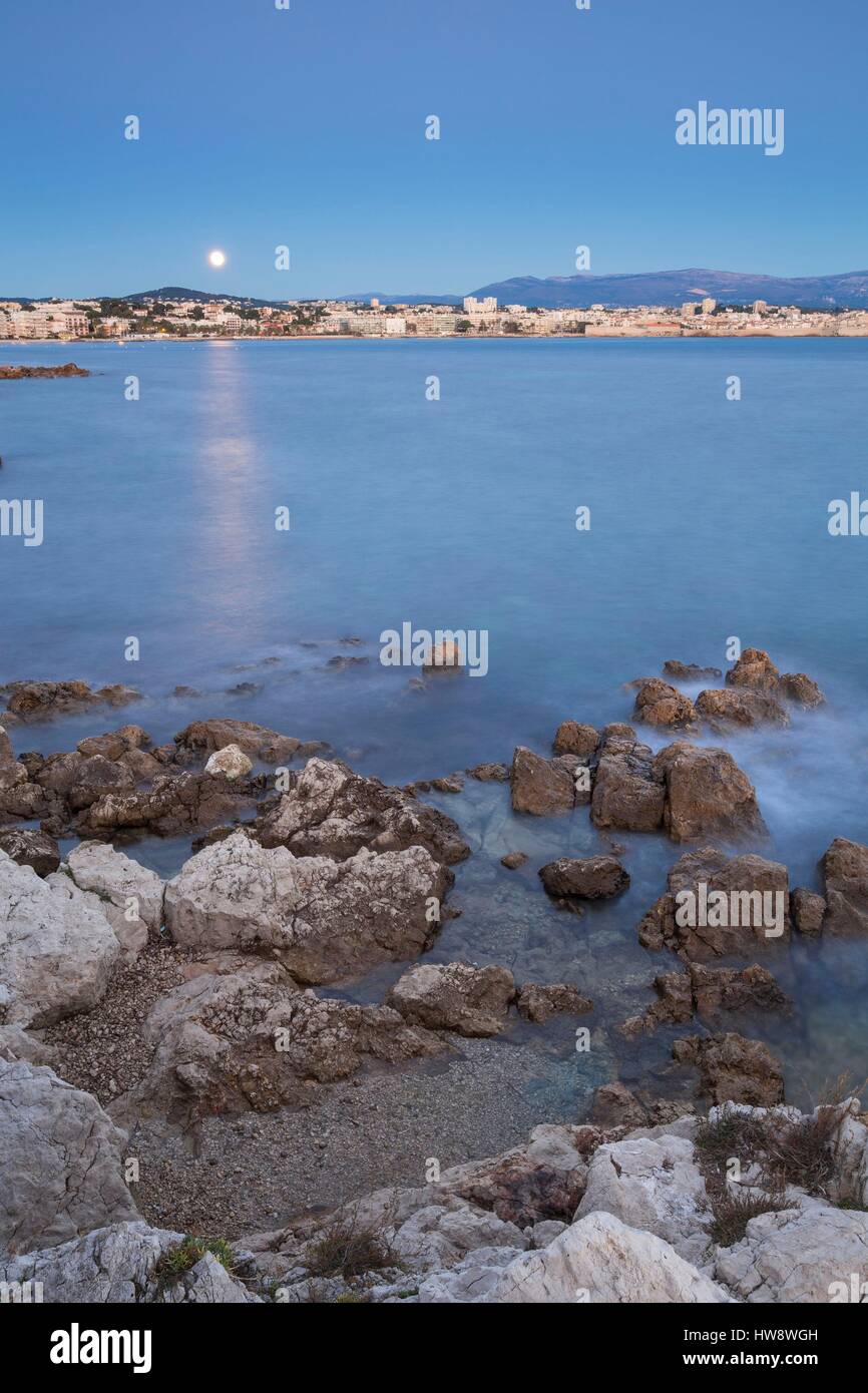France, Alpes Maritimes, moonset on Antibes city from the Cap d'Antibes Stock Photo