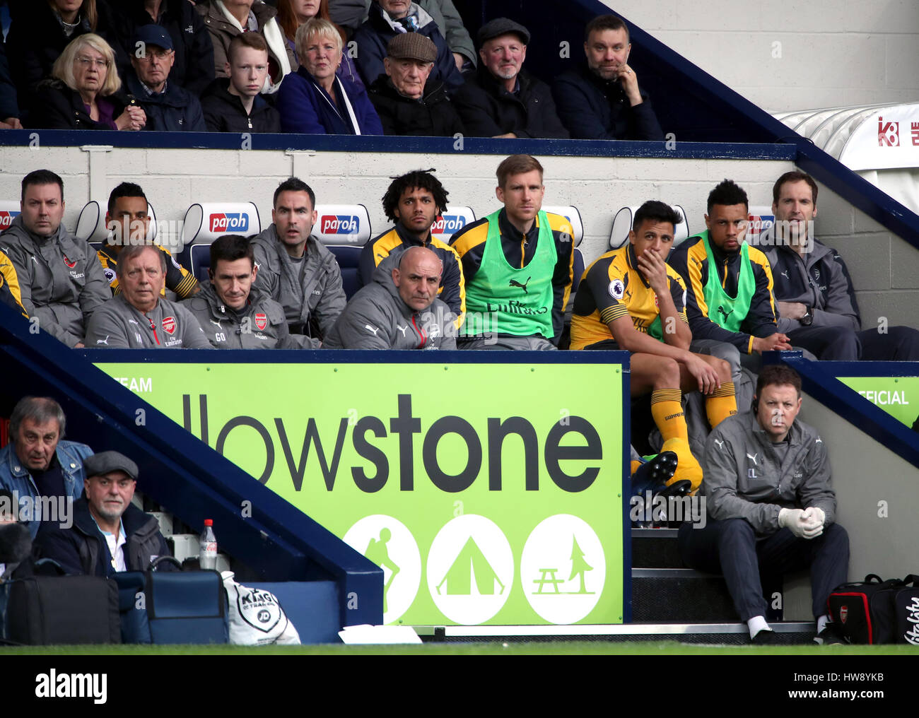 Arsenal's (right-left) Petr Cech, Francis Coquelin, Alexis Sanchez, Per Mertesacker and Mohamed Elneny on the bench during the Premier League match at The Hawthorns, West Bromwich. Stock Photo