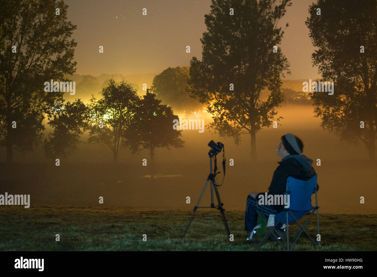 Astronomy Photographer During Sunset Stock Photo