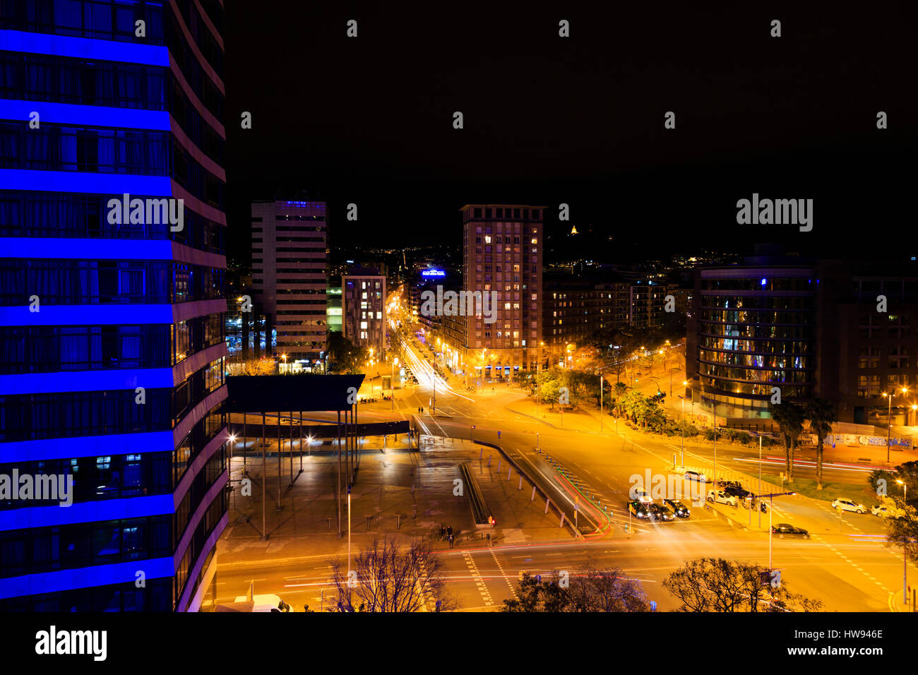 Night time view of Placa dels Paisos Catalans with traffic light trails. Barcelona, Catalunya, Spain Stock Photo