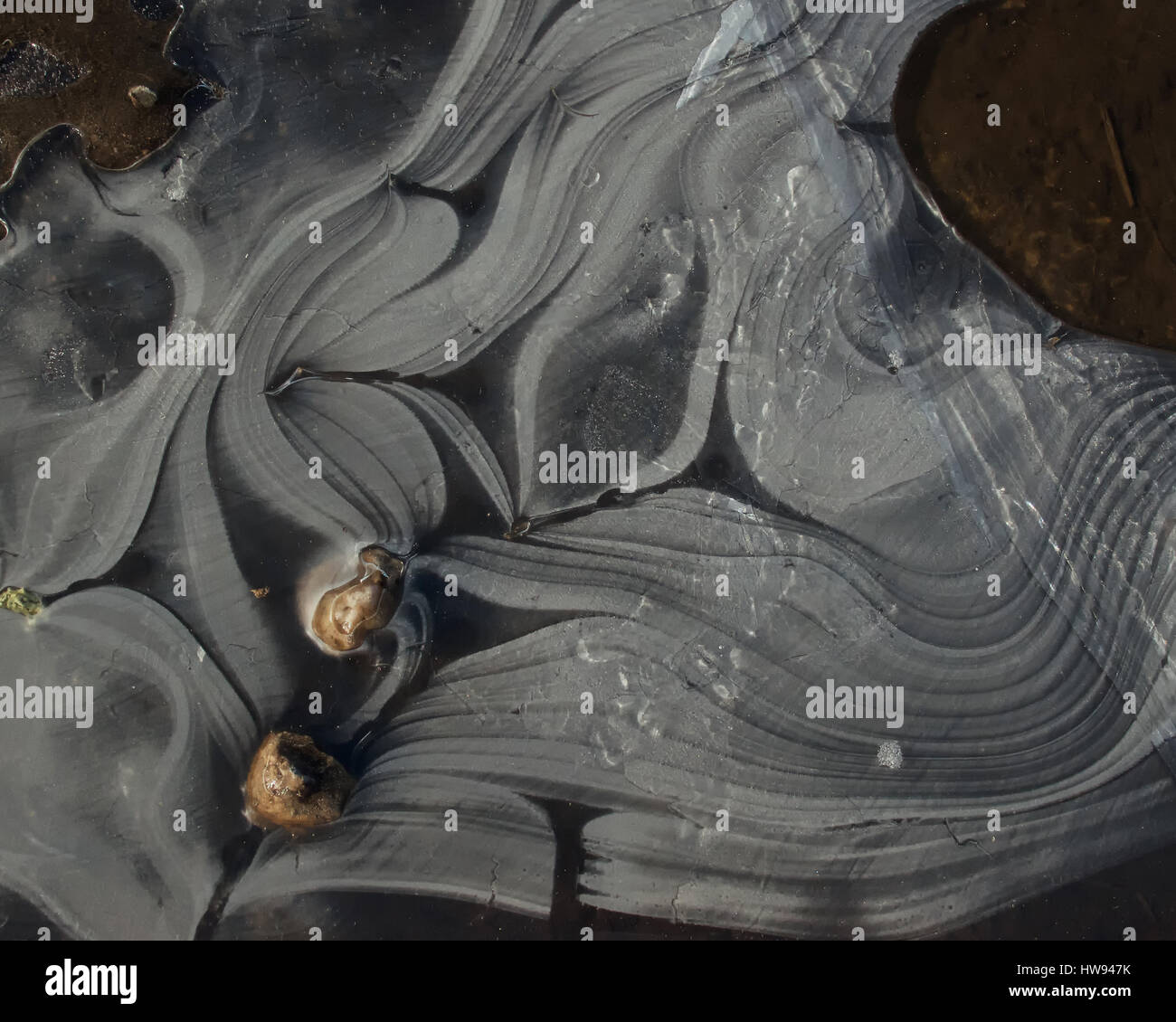 Swirl patterns in ice Stock Photo