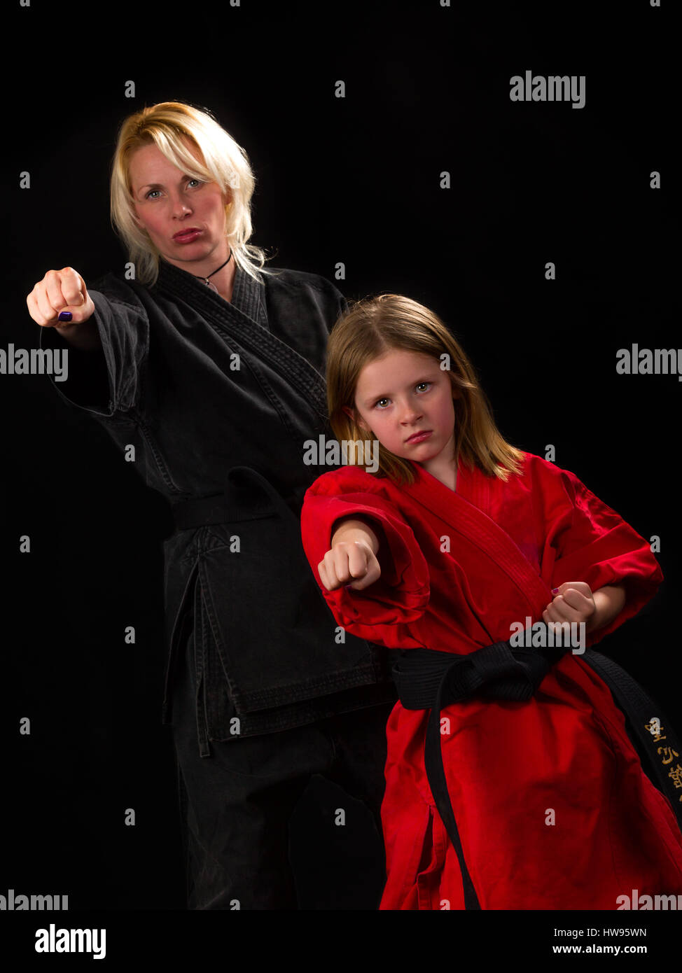 Mother and daughter practicing karate Stock Photo