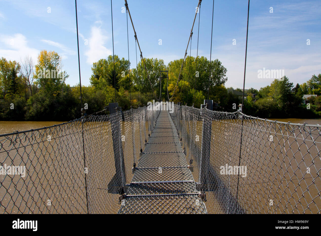 Star Mine Suspension Bridge, a 117 metre long pedestrian suspension bridge across the Red Deer River near Rosedale, Alberta, Canada Stock Photo