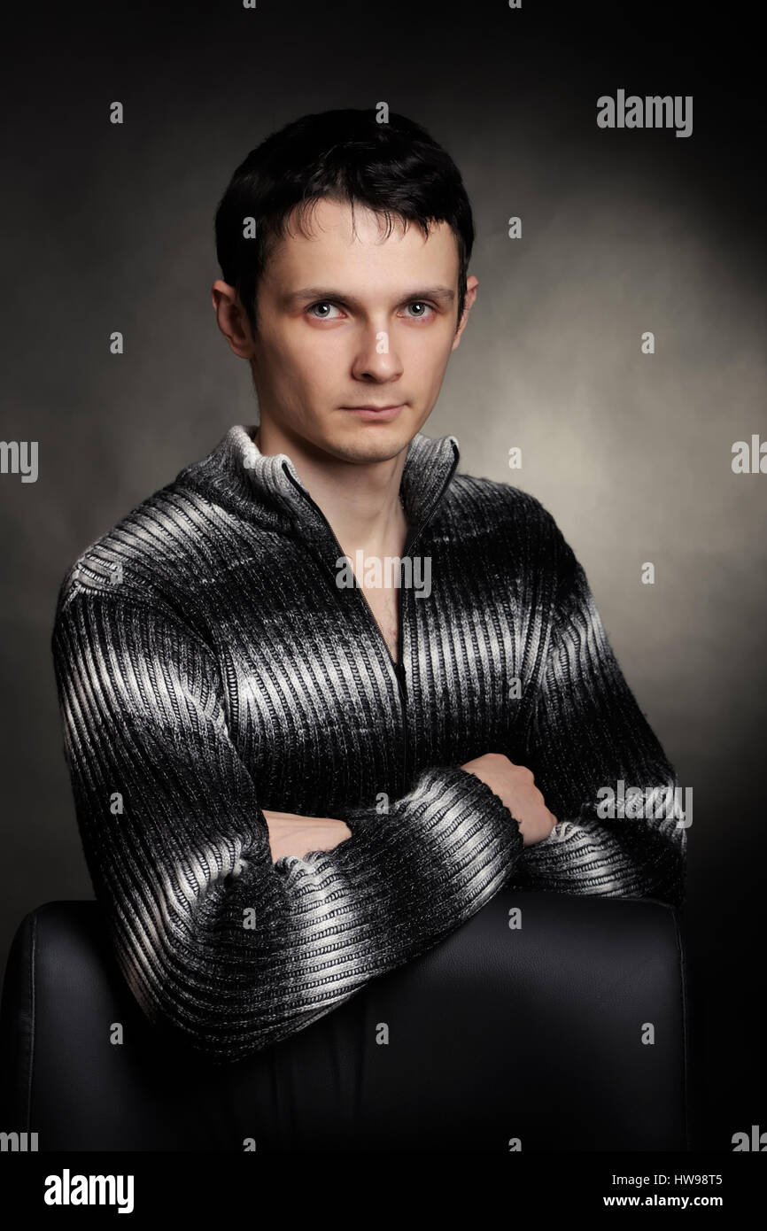 Young man portrait on dark background Stock Photo - Alamy