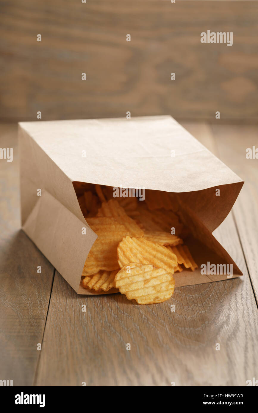 rippled potato chips with paprika in paper bag Stock Photo Alamy