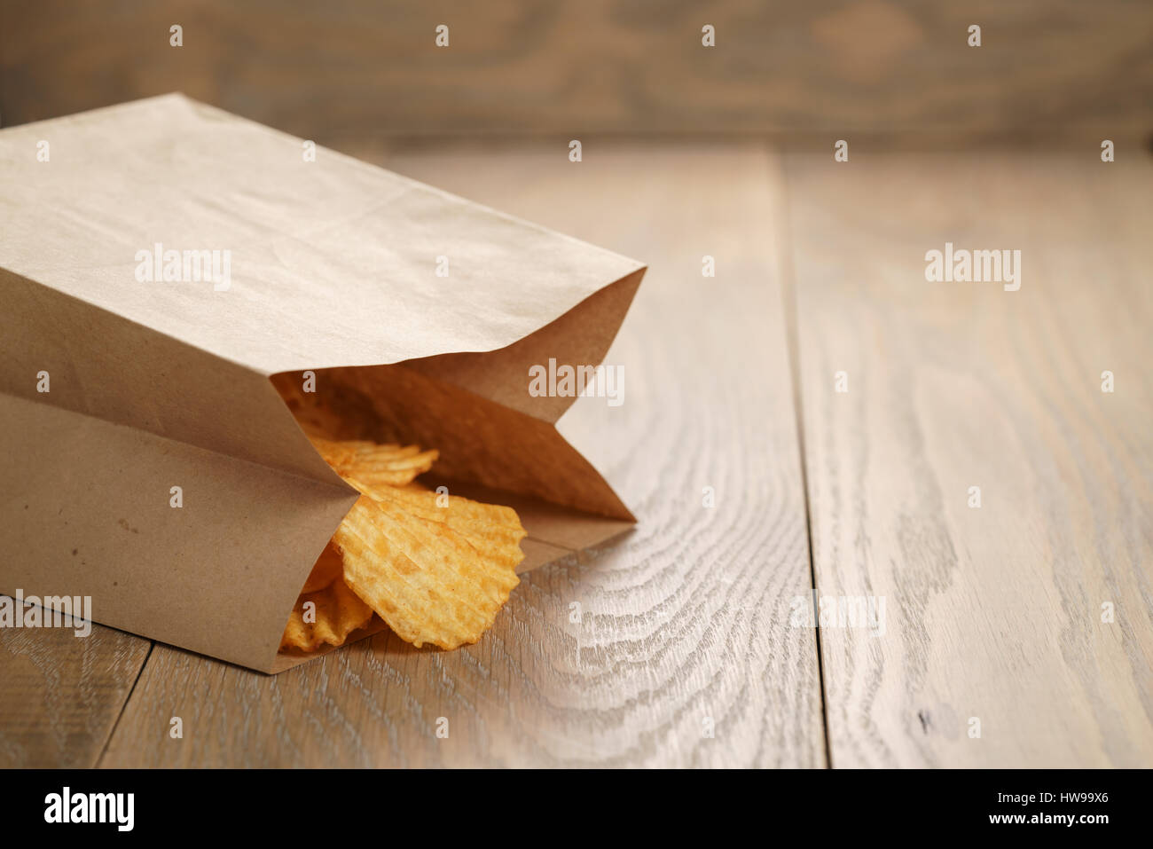 rippled potato chips with paprika in paper bag Stock Photo Alamy